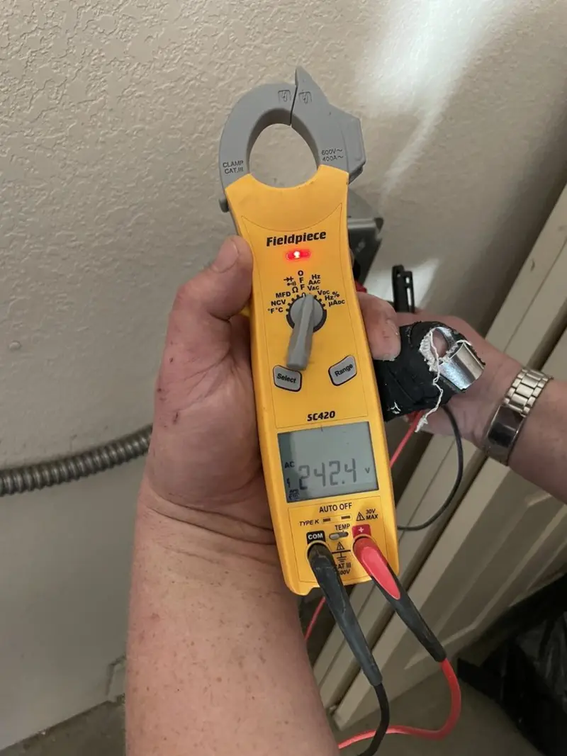 Voltage testing with clamp meter during Whole House Surge Protector in Boaz
